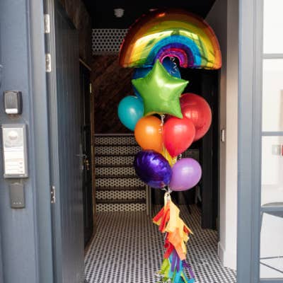 Rainbow birthday surprise helium balloons