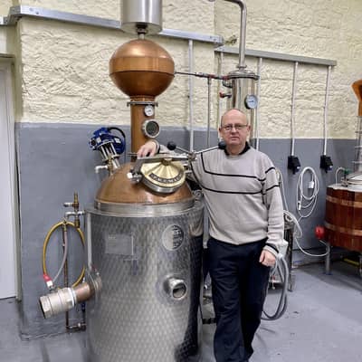 Andrew in the distillery with his latest still