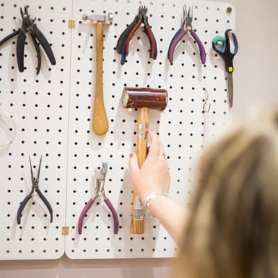 Abigail Jewellery Selecting A Hammer from Peg Board Storage