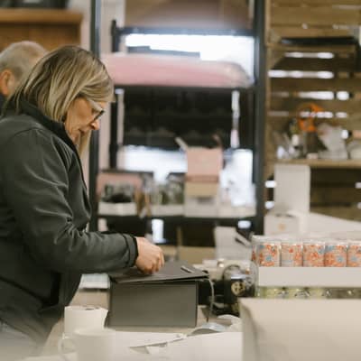 Carefully packaging Gin & Rum Warehouse orders.