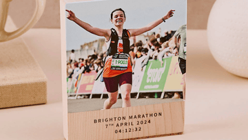 Personalised biscuit medal with "Go Archie" in icing