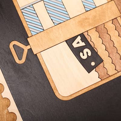 Close up of wooden wall art by snork of inspirational typographic poster inspired by David Bowie’s moorage daydream