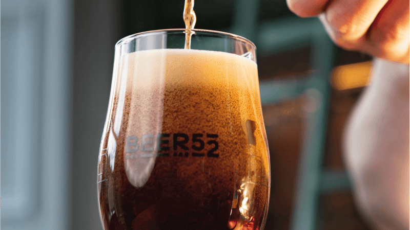 The White Hag beer being poured into a Beer52 glass