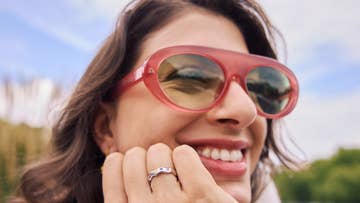 woman wearing red sunglasses