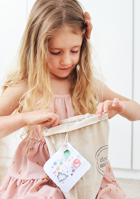 Excited girl with glitter birthday play dough