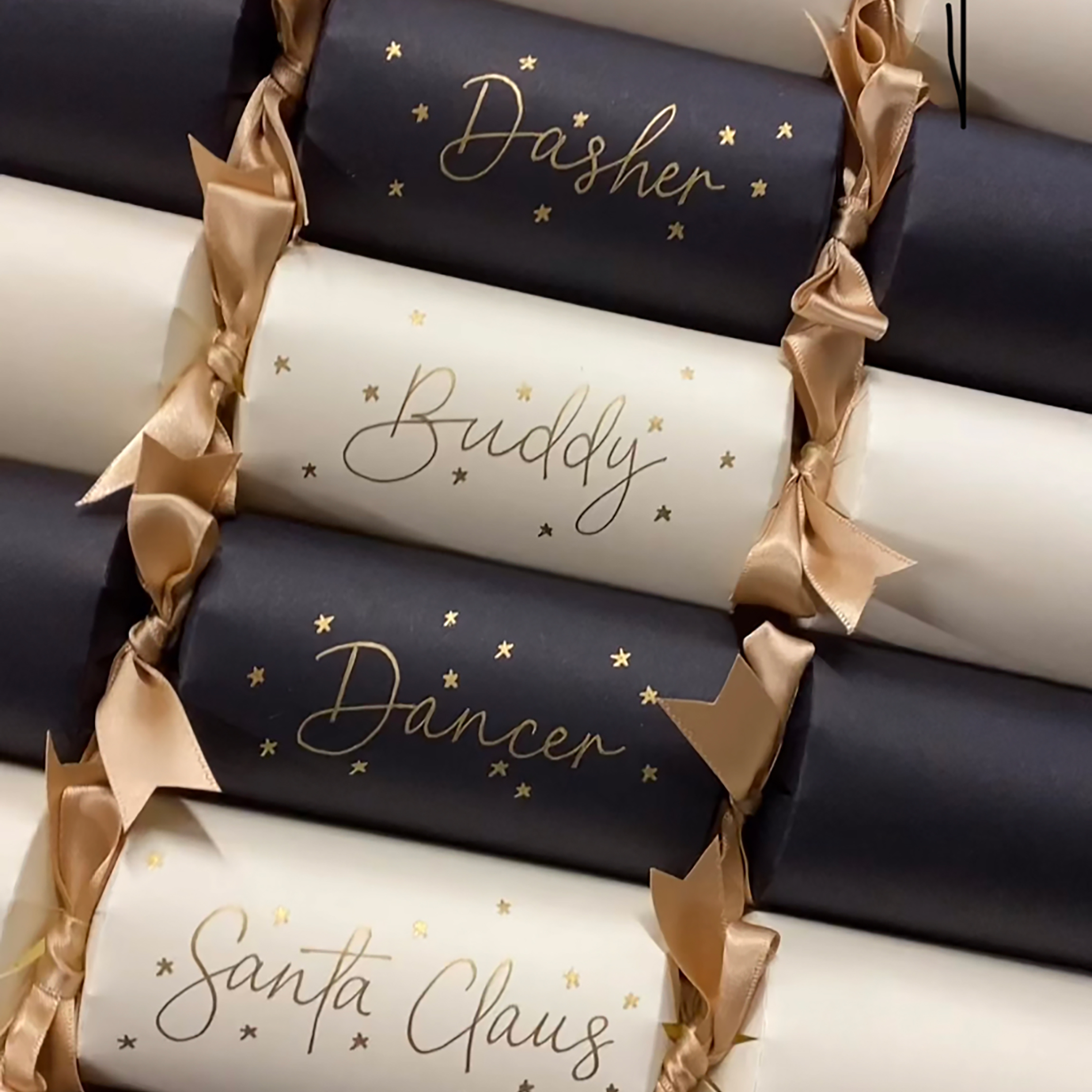 Handwritten and decorated, these personalised Christmas table crackers add a special name place setting to the Christmas table.