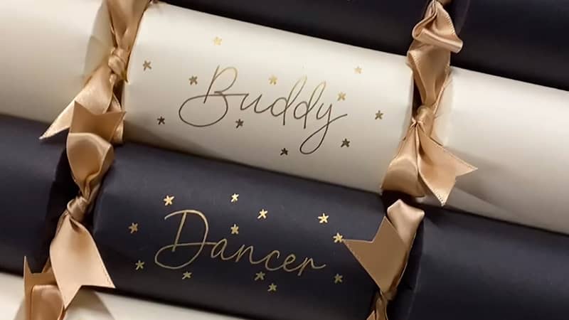 Handwritten and decorated, these personalised Christmas table crackers add a special name place setting to the Christmas table.