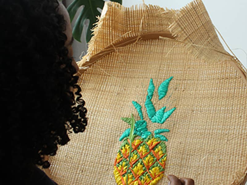 Image of Tihara Smith doing raffia hand-embroidery