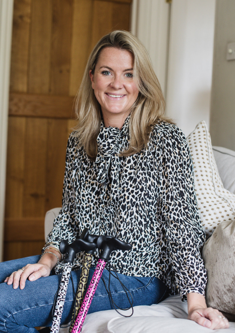 Amelia Co-Founder Wearing Leopard Walking Sticks