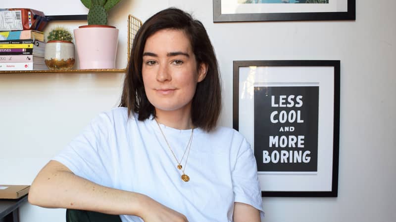 Girl eating watermelon with gold rings and blue background