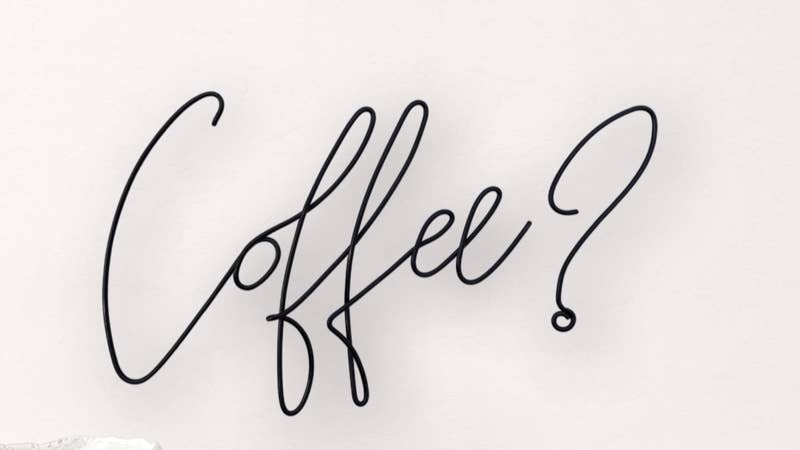 Coffee Wire words on a white wall