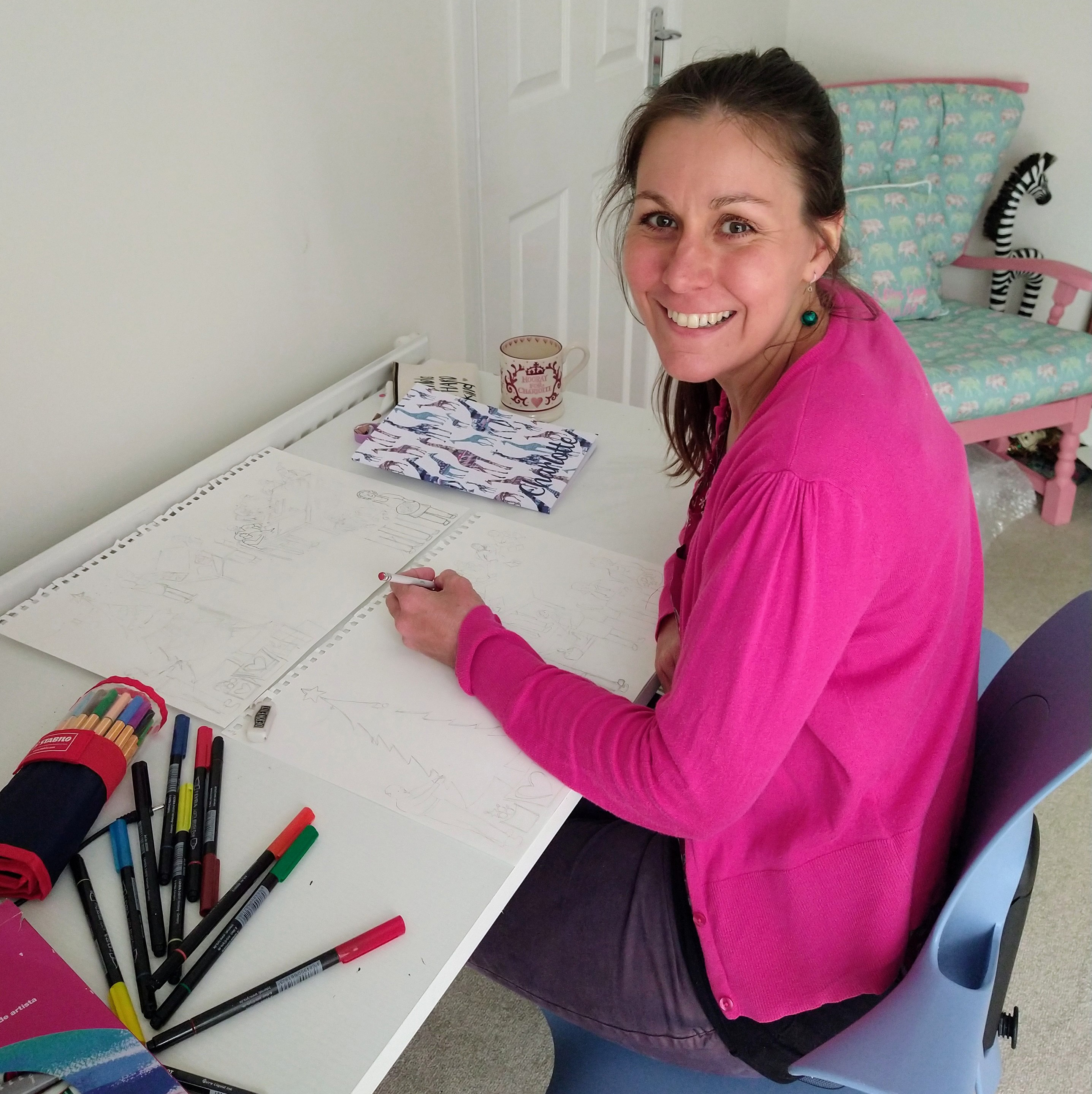 Lottie at her desk drawing