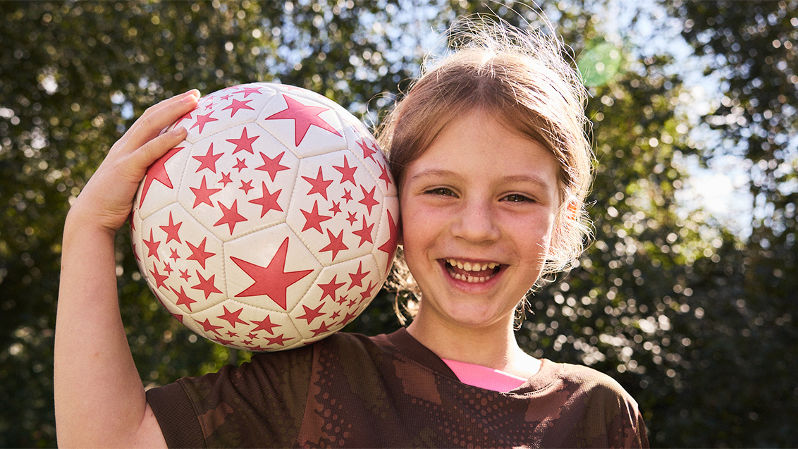 girl with football 