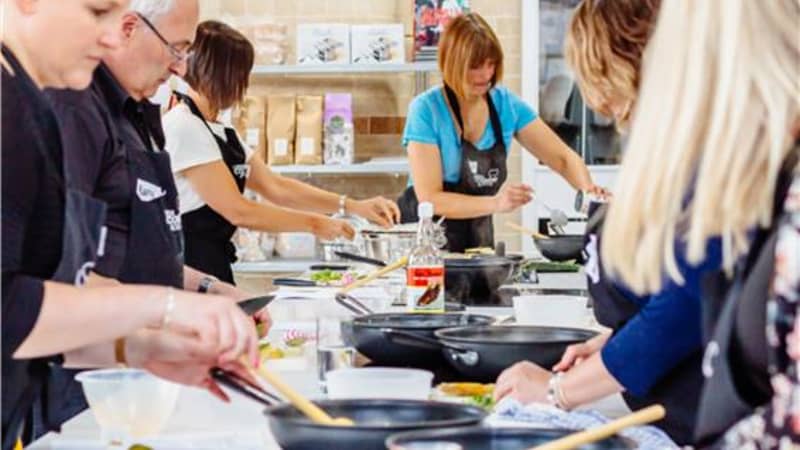 People cooking in Leeds Cookery School
