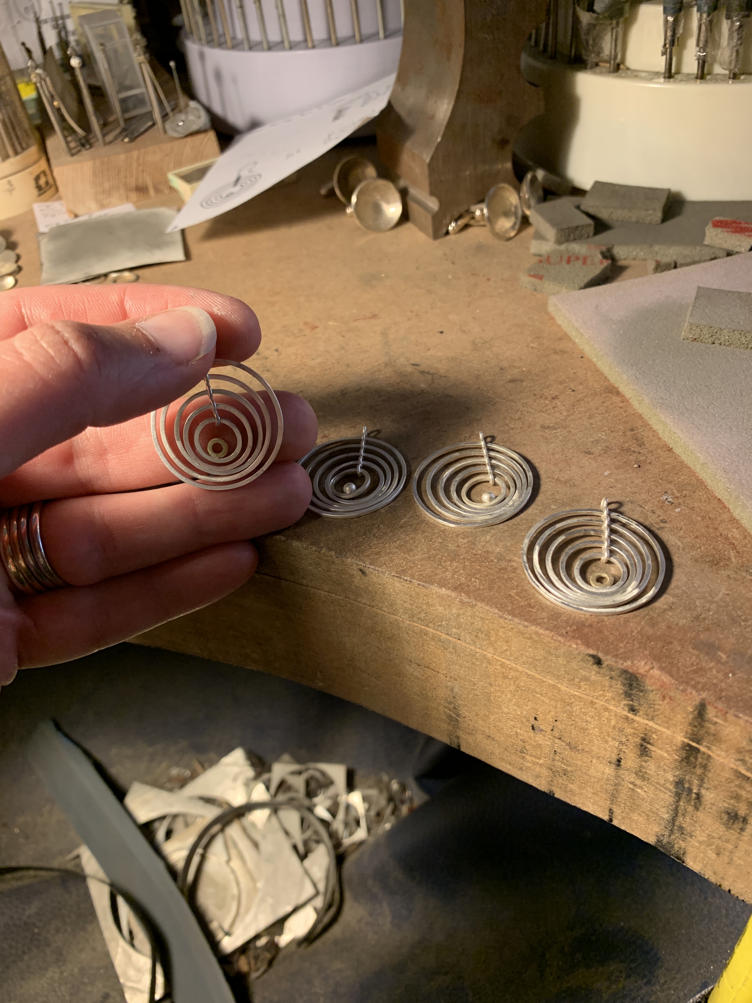 Machi de Waard working on earrings at bench