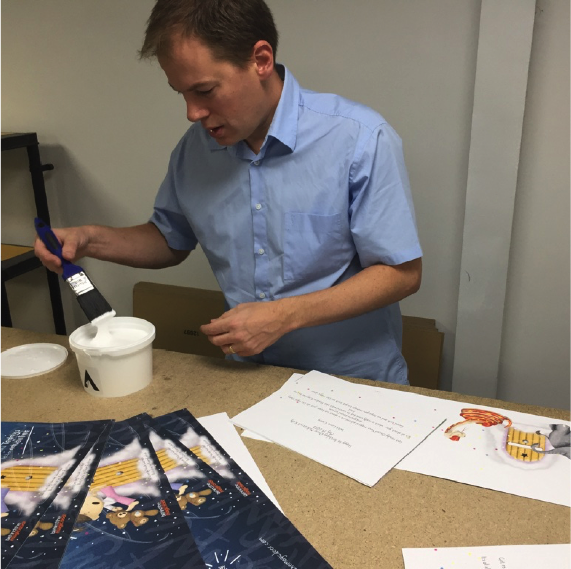 Richard helping assemble the books
