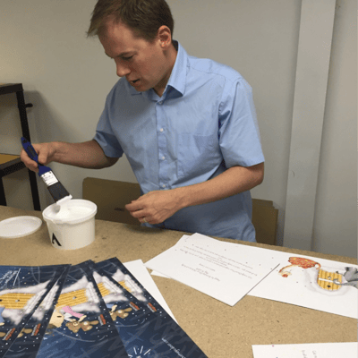 Richard helping assemble the books