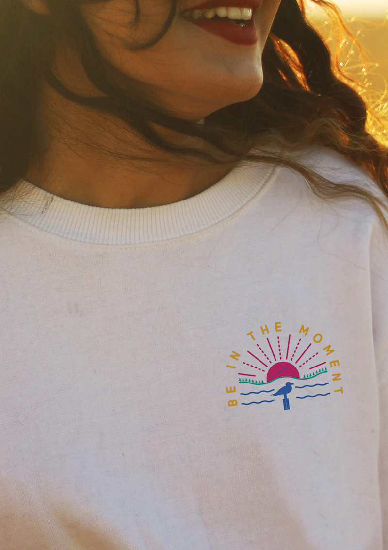 girl wearing Be in the Moment crew sweat