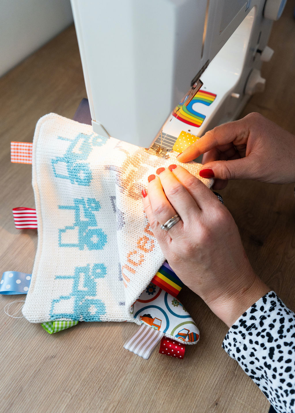 Rosie sewing around a comforter blanket at her sewing machine