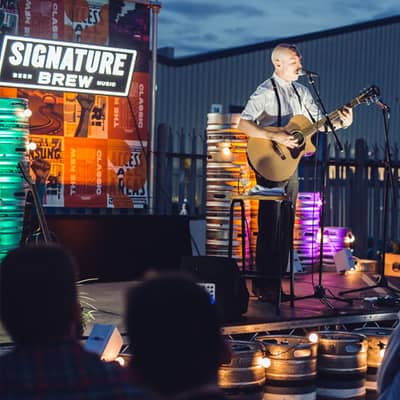 Independent musician Jamie Lenman playing outdoors at our state of the art brewery in Walthamstow, London, E17