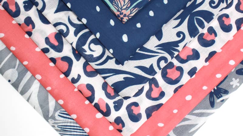 Selection of furoshiki fabric gift wrap patterns, and colours ranging from grey, though pinks and blushes, to navy and mint