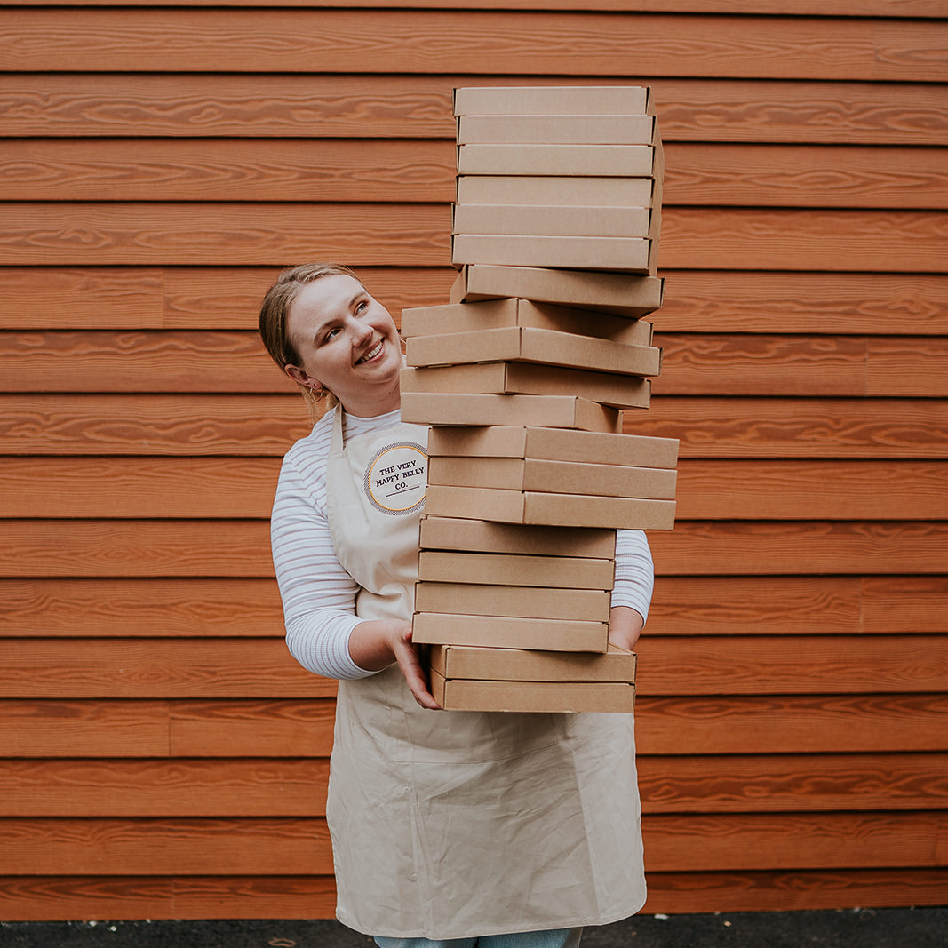 The Very Happy Belly Co owner holding a baking kit