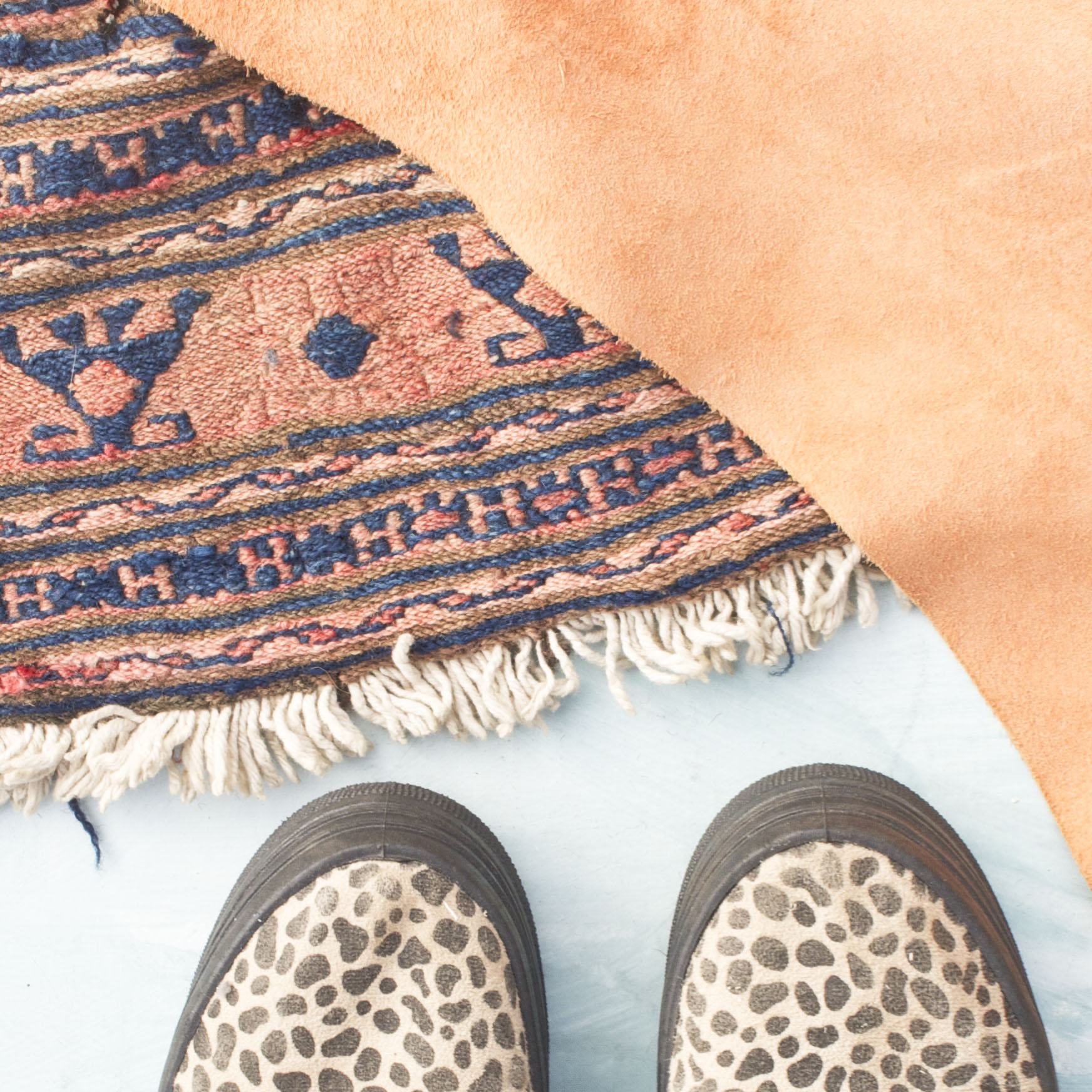 Antique Kilim rug and peach suede