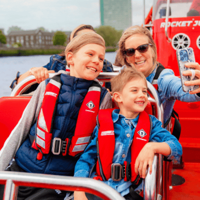 A family enjoying a Thames Rockets London speedboat on their family day out. Unique London activity