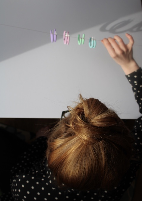 Designer Laura with pastel hoop earrings by Wear With Grace Studio. 