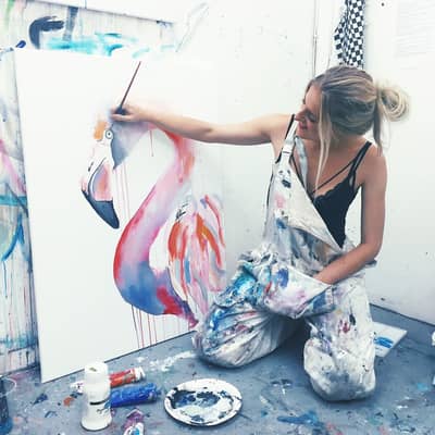 In my overalls at my studio painting a flamingo as part of my animal series