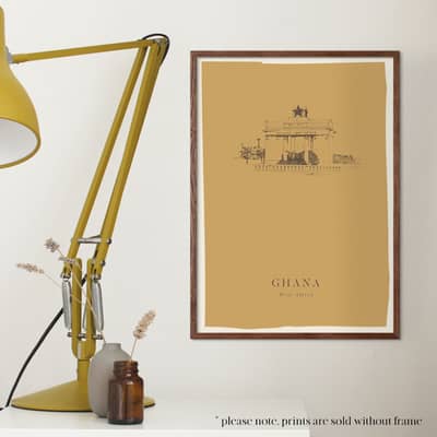 A black and white photograph of Fiona (from the shoulders up) from Fiona's Notes standing in front of an exposed brick wall