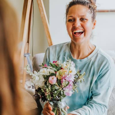 Posy of British seasonal flowers with recipient