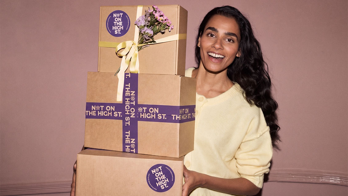 hand holding colourful cups
