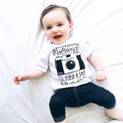 On the run from the Mamarazzi, I'll flash a smile if she can catch me.