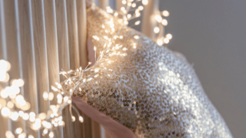 Silver Cluster Fairy Lights wrapped on the headboard