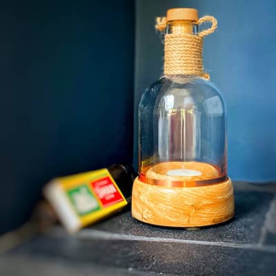 Gin Bottle Tealights - A Real Gin Bottle cut in half on a handmade woodturned base