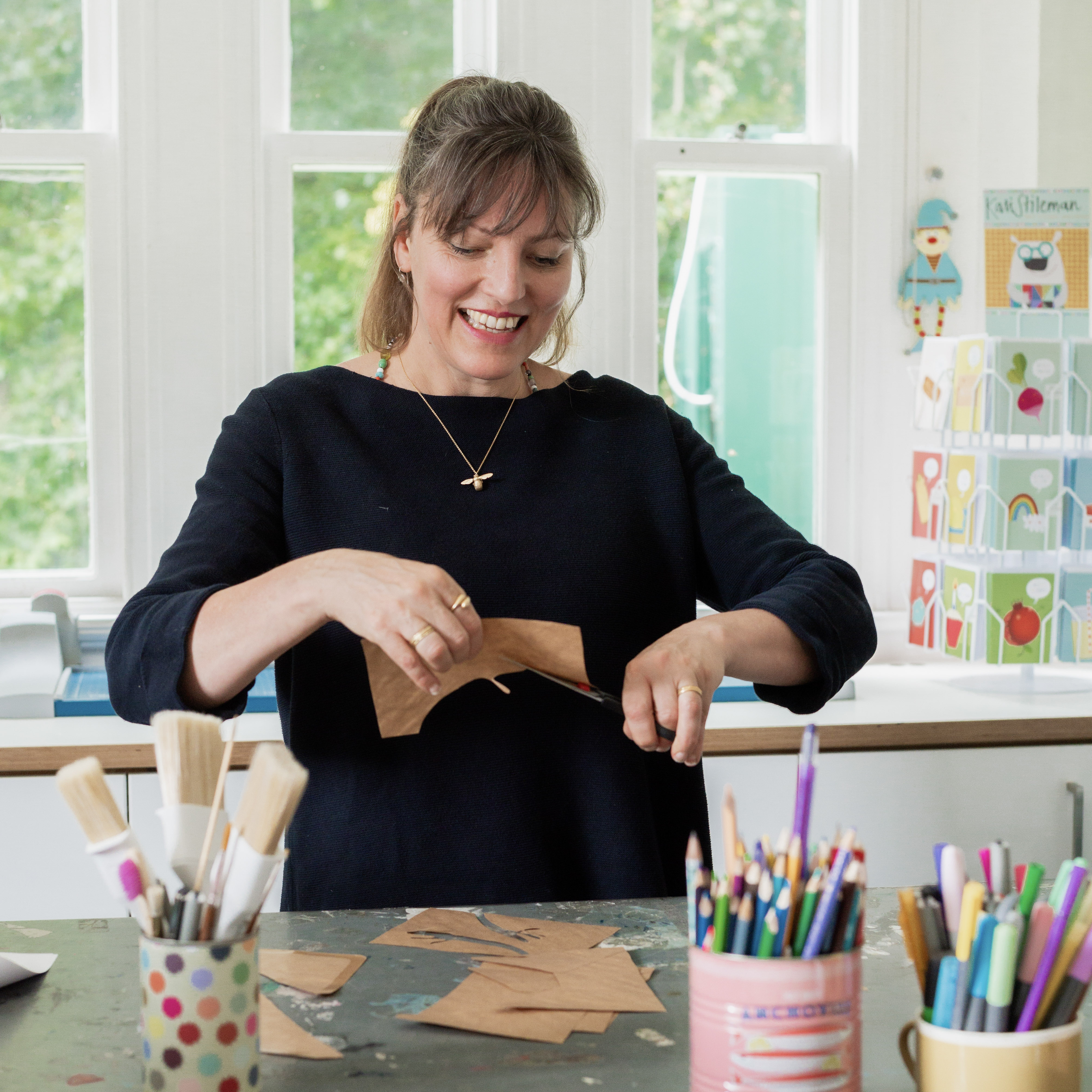 All of our designs begin with hand cut paper collages. 