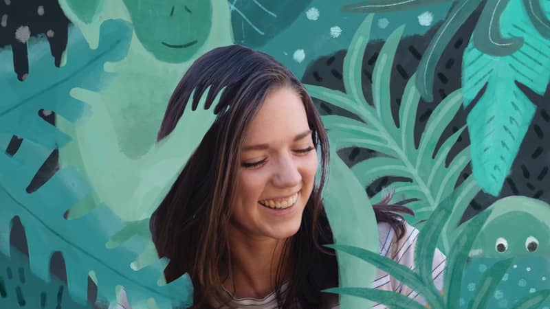 An illustrated monkey gets a shoulder ride from Illustrator designer Georgia Camden