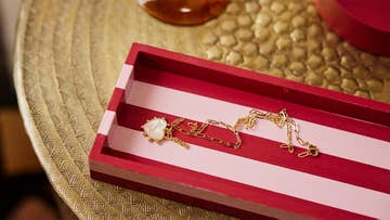 heart necklace on stripy tray