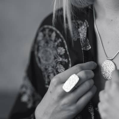 julie bailey papermetal jewellery intaglio embossed silver pendant and ring