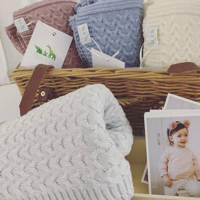 A range of blankets, clothing and keepsakes in soft organic cotton.