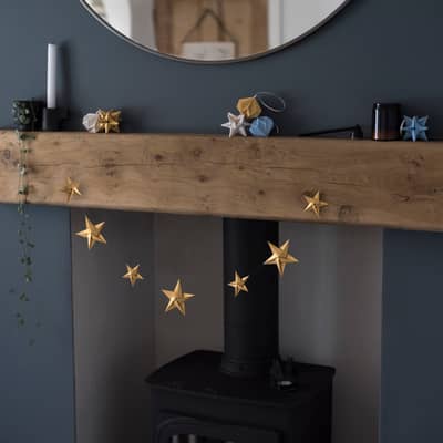 Origami Blooms Christmas decorations on fireplace