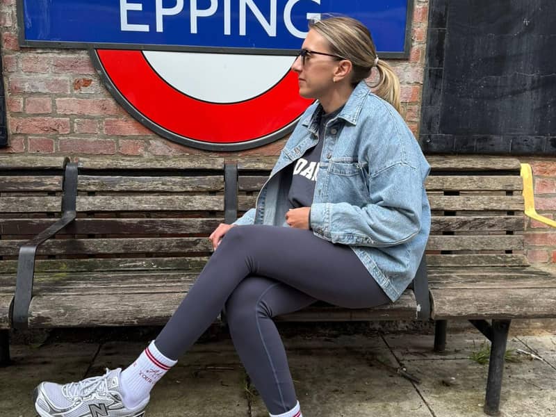 sitting next to tube sign