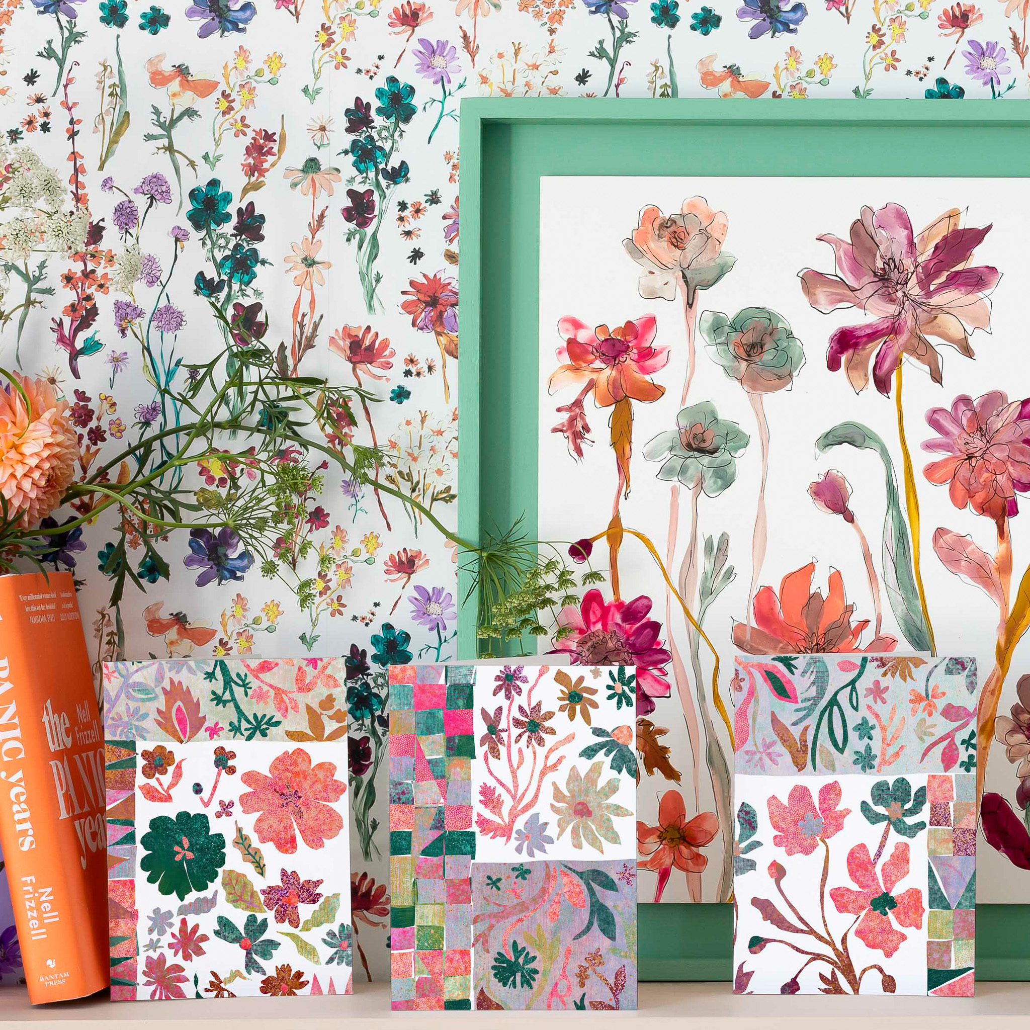A collection of Floradore's Quilted Blooms greetings cards against Floradore wallpaper.