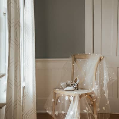 Floral veil draped over a chair