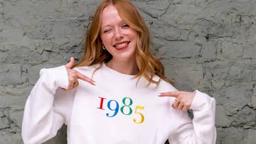 woman with embroidered birth year sweatshirt