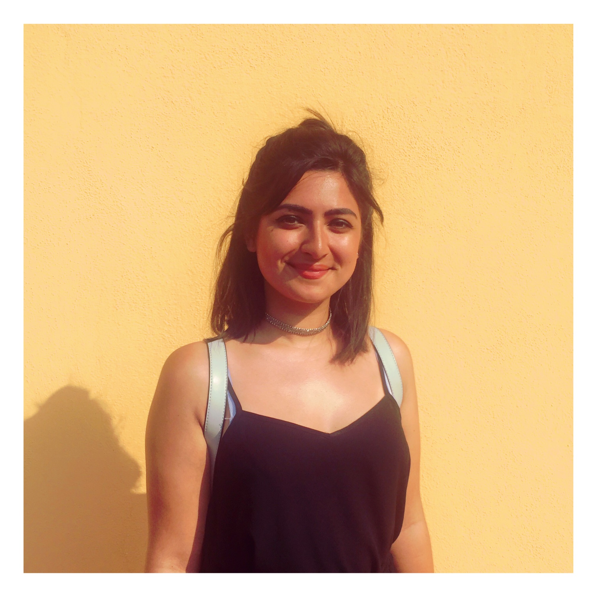 Portrait images against orange wall