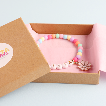 kraft gift box with bracelet wrapped in tissue paper