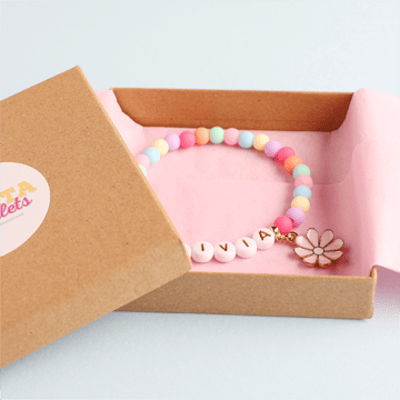 kraft gift box with bracelet wrapped in tissue paper