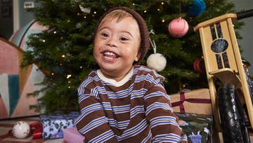 boy with christmas presents hero banner